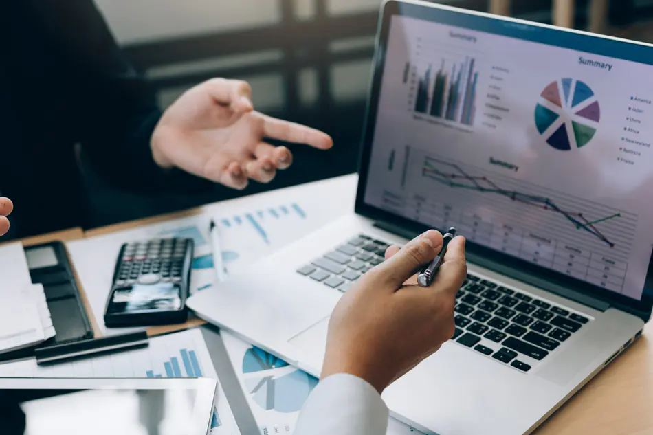 Two people looking at financial summaries
