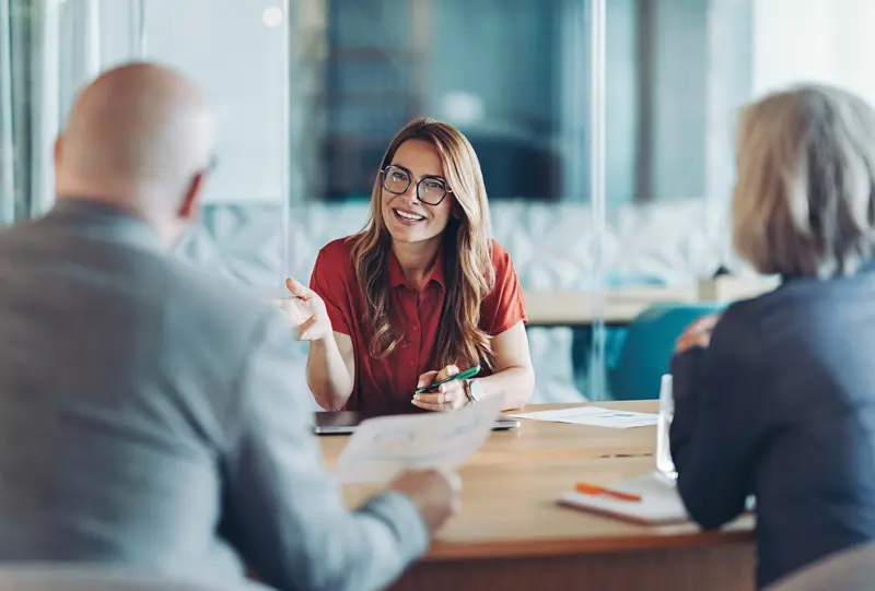 Accountant speaking with 2 business owners