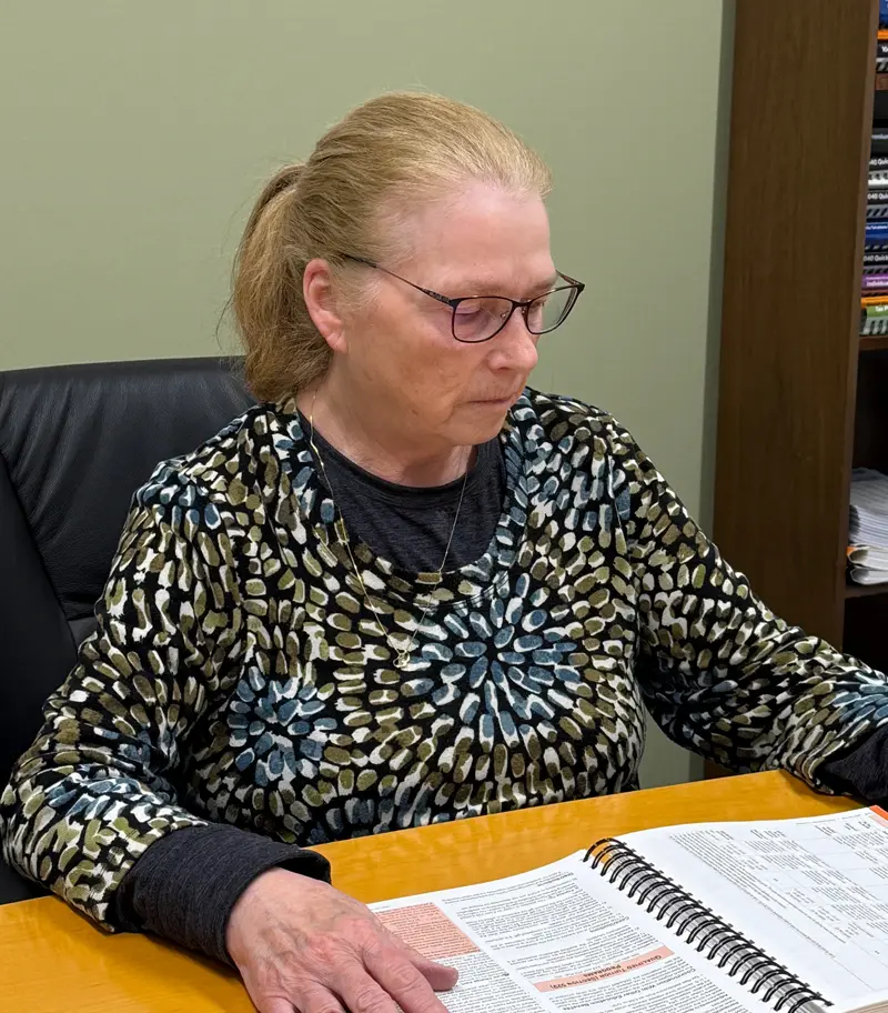 Jacqueline Way sitting at a desk