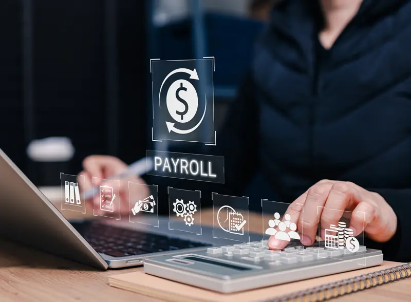 Payroll business finance management concept of a women calculating a payroll
